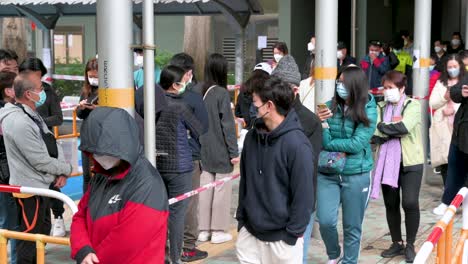 Chinese-residents-walk-through-a-Covid-19-Coronavirus-mass-testing-as-a-public-housing-complex-is-placed-under-lockdown-after-a-large-number-of-residents-tested-positive