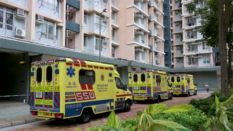 Ambulances-are-seen-parked-outside-a-building-placed-under-lockdown-at-a-public-housing-complex-after-a-large-number-of-residents-tested-positive