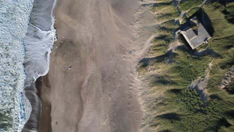 Bunker-at-Klitmoller-Beach---Smooth-Waves-Crashing-On-Sandy-Beach,-Stunning-Turquoise-Water,-Denmark,-Europe