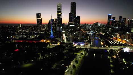 Aerial-circling-Melbourne-South-bank-arts-district-golden-glow-sunset