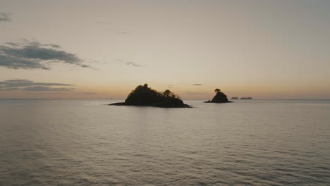 Silhouette-Of-Islet-In-Guanacaste,-Costa-Rica-At-Sunset---aerial-drone-shot