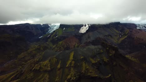 Aerial-panoramic-view-of-mountains-and-glacier-landscape,-in-the-Fimmvörðuháls-area,-Iceland
