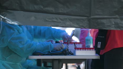 Chinese-residents-go-through-a-Covid-19-coronavirus-mass-testing-outside-a-public-housing-building-placed-under-lockdown-after-a-large-number-of-residents-tested-positive