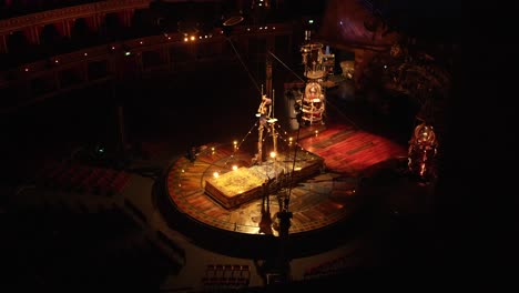 Cirque-Du-Soleil:-Professional-athletes-practicing-balancing-duo-in-a-beautiful-concert-hall,-circus-act-warming-up-in-slow-motion
