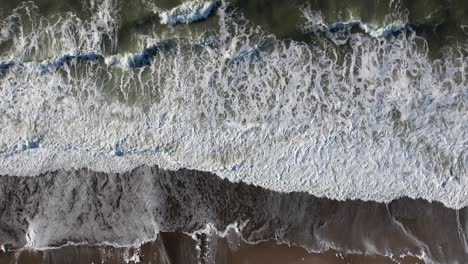 Overhead-Shot-Of-Beautiful-Soft-Waves-In-Peaceful-Blue-Ocean,-Denmark,-Europe