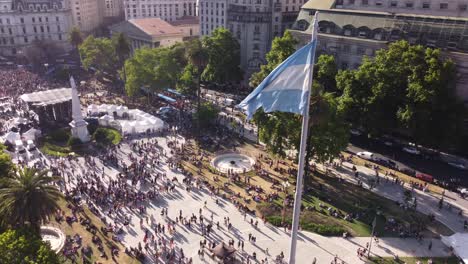 Drone-flying-around-Argentinian-flag-waving-in-Plaza-de-Mayo-during-march-LGBT-event-pride-parade-in-Buenos-Aires-city