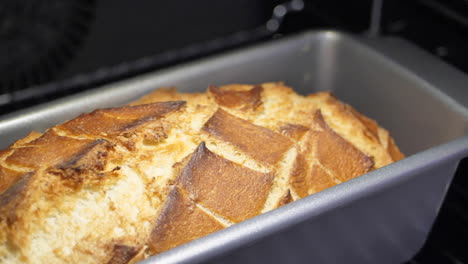 Close-up-shallow-focus-of-a-loaf-of-fresh-bread-baking-in-the-oven
