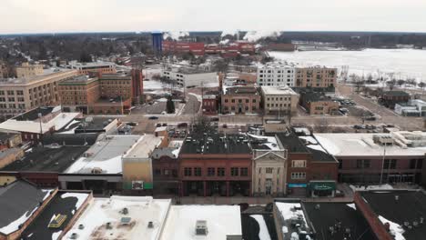 Aerial,-main-street-in-Stevens-Point,-Wisconsin-during-winter-season