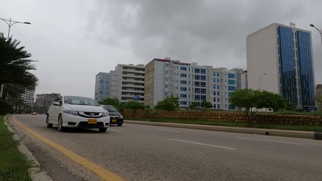 Low-Angle-View-Along-Highway-Road-Beside-Developments-At-Bahria-Housing-Development-In-Karachi