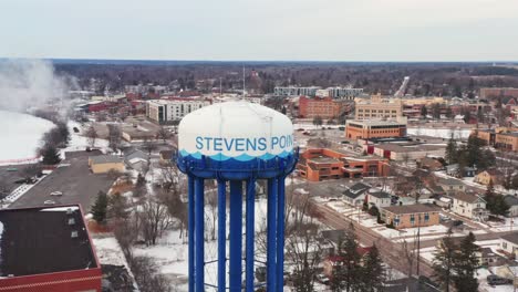 Aerial,-Stevens-Point-water-tower-in-Wisconsin-during-winter-season