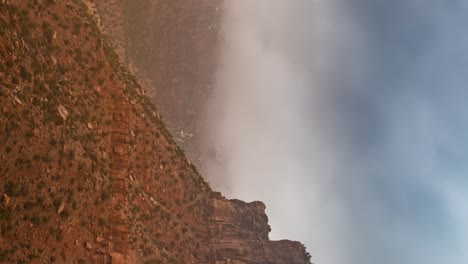 Misty-fog-along-a-butte-in-the-Southern-Utah-desert---vertical-time-lapse