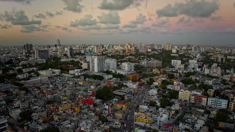 Timelapse-of-Santo-Domingo-town-center-with-car-traffic-and-clouds-moving-in-sky-at-sunset