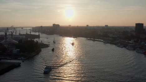 Hamburg-Harbour-at-Golden-Hour-with-sun-and-Russian-Yacht-in-the-shot-during-Hamburg-Cruise-Days