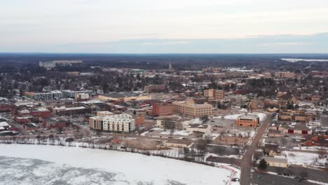 Aerial,-downtown-Stevens-Point,-Wisconsin-during-winter-season