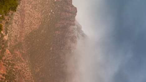 Misty-fog-over-red-cliffs-in-the-Southern-Utah-desert---vertical-time-lapse