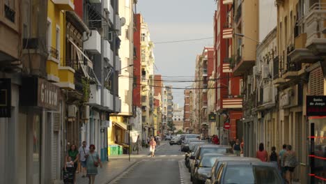 Lively-street-in-residential-area-of-Valencia-on-summer-day,-Spain