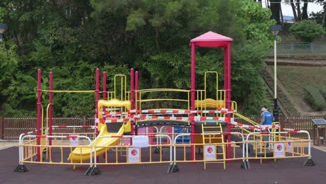A-closed-slide-play-with-tapes-and-barriers-seen-at-a-public-playground-due-to-the-Covid-19-Coronavirus-outbreak-and-restrictions-in-Hong-Kong