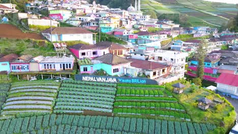 Drone-shot-of-The-word-"Nepal-Van-Java"-on-the-beautiful-village
