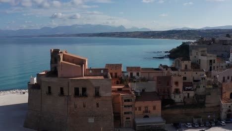 Aerial-Dolly-Towards-Castello-Arabo-Normanno-With-Gulf-Of-Castellammare-In-Background