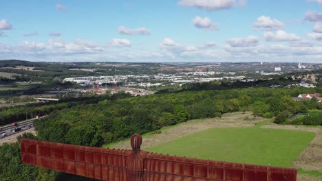 Drone-shot-revealing-the-Angel-of-the-North-with-Newcastle-upon-Tyne-in-the-background-in-the-north-East-of-England
