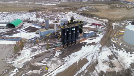Black-silos-containing-the-materials-needed-in-making-cement-is-seen-in-an-aerial-drone-viewpoint-of-the-at-the-Calgary-Lafarge-cement-plant-at-Spyhill-and-surrounding-area