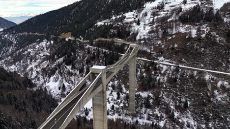 High-modern-Ganter-Bridge-on-the-way-to-the-Simplon-Pass-between-the-high-mountains-in-the-Swiss-alps-in-wintertime