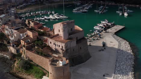 Aerial-Close-Up-View-Of-Castello-Arabo-Normanno-Located-Beside-Castellammare-Del-Golfo-Port
