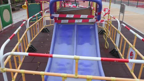 A-closed-slide-play-with-tapes-and-barriers-seen-at-a-public-playground-due-to-the-Covid-19-Coronavirus-outbreak-and-restrictions-in-Hong-Kon
