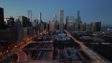 Aerial-view-from-Michigan-Avenue-to-Lake-Street,-winter-dusk-in-Chicago,-USA---tracking,-drone-shot