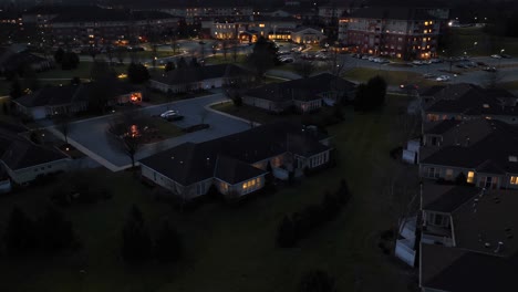 Aerial-hyperlapse-of-retirement-community-with-cottages,-houses,-homes,-and-assisted-living-building