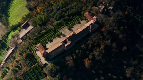Aerial-Flying-Overhead-Rooftop-Of-Castle-of-Montalto-Pavese-In-Lombardy-Italy