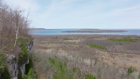 Bruce-peninsula-cliffs,-Ontario,-Canada-in-early-spring-and-lake-Huron,-Drone