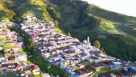 Aerial-view-of-beautiful-Indonesian-village-on-the-slope-of-mountain-called-Nepal-Van-Java-in-the-morning