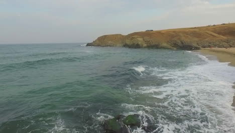 sea-waves-breaking-into-rocks