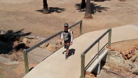 Man--walking-in-a-park-in-Australia