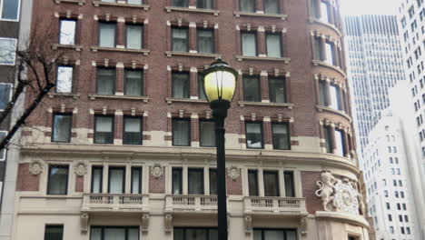 Lamp-post-in-front-of-early-twentieth-century-buildings