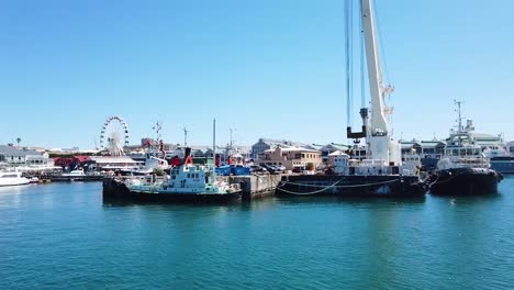Cruising-into-the-harbour-of-the-V-A-Waterfront-in-Cape-Town,-South-Africa