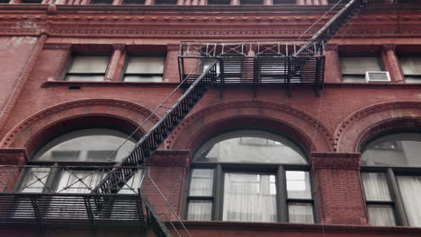 Traditional-brownstone-with-fire-escape.
Low-angle-pan