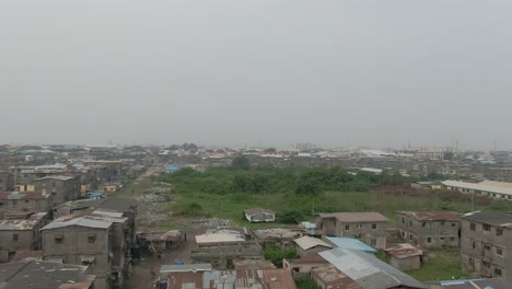 Aerial-shot-of-Jakande-slum-in-Lekki,-Lagos,-Nigeria,-Africa