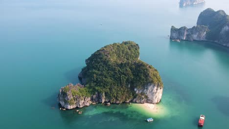 Aerial-drone-shot-over-Ha-Long-Bay,-blue-sea-and-limestone-islands-of-Lan-ha-bay
