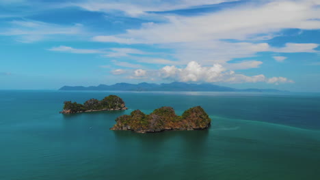 Clear-aerial-view-of-two-neighboring-islands-near-Langkawi-Island-in-Malaysia,-Pulau-Gasing-and-Pulau-Pasir