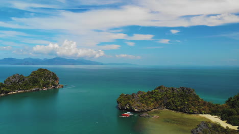 Beautiful-seascape-drone-footage,-shot-on-a-sunny-cloudy-day-near-Langkawi,-Malaysia,-capturing-Pulau-Gasing-and-Pulau-Pasir,-Strait-Of-Malacca-and-Ko-Tarutao-