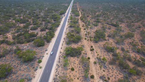 Car-drives-on-the-open-highway,-aerial-follow-shot