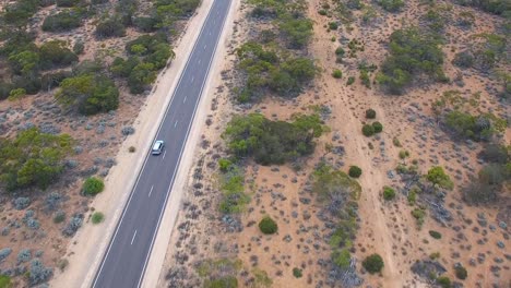 Car-drives-on-the-open-highway,-aerial-follow-shot