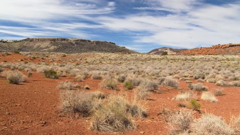 A-moving,-wide-angle-shot-of-the-arid,-desert-landscape-at-Wupatki-National-Monument-in-Arizona