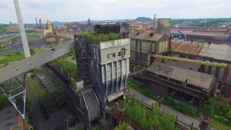 Aerial-drone-footage-of-an-old,-abandoned-coke-coal-factory-Carsid-in-Charleroi