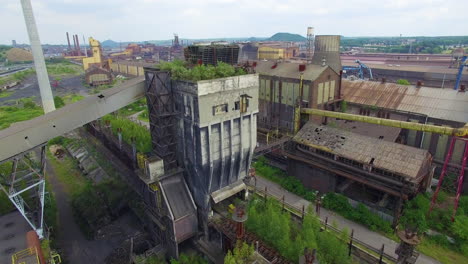 Aerial-drone-footage-of-an-old,-abandoned-coke-coal-factory-Carsid-in-Charleroi