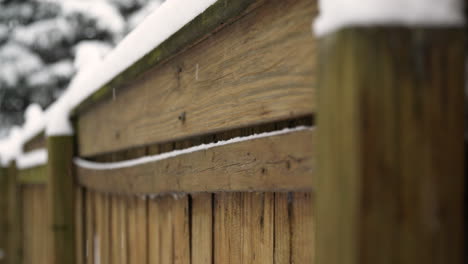 Snow-Falling-Against-Fence-in-Slow-Motion