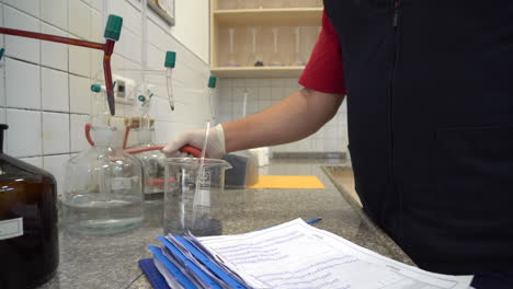 Laboratory-assistant-takes-water-samples-in-the-laboratory