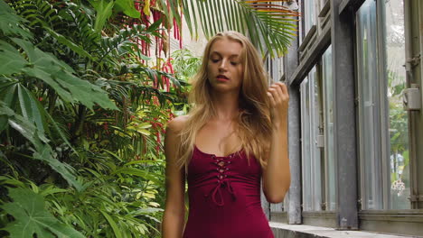 Slim-bikini-model-walking-in-a-beautiful-botanic-garden
